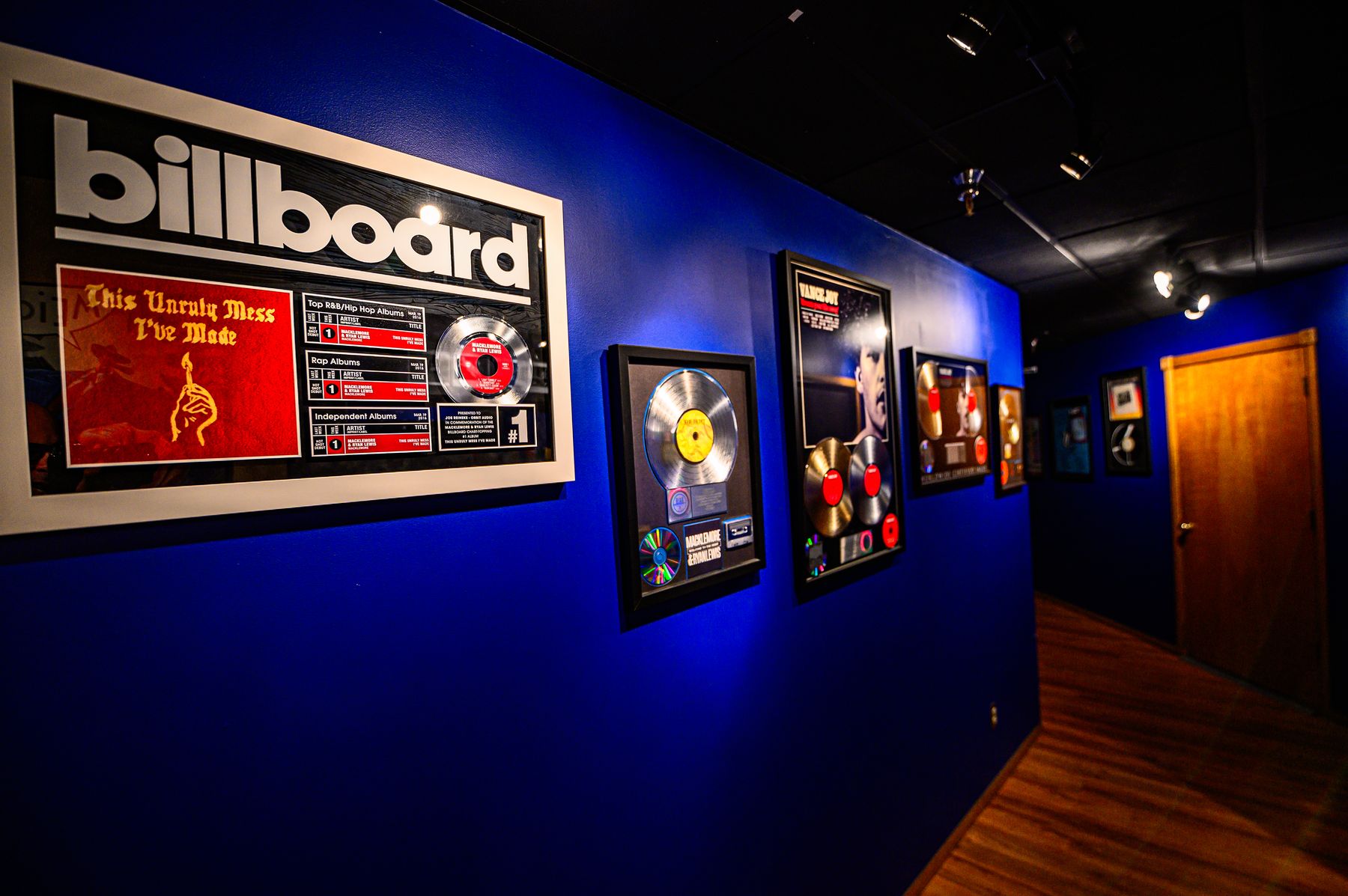 Gold and platinum plaques on the wall at Orbit Audio, a Seattle recording studio